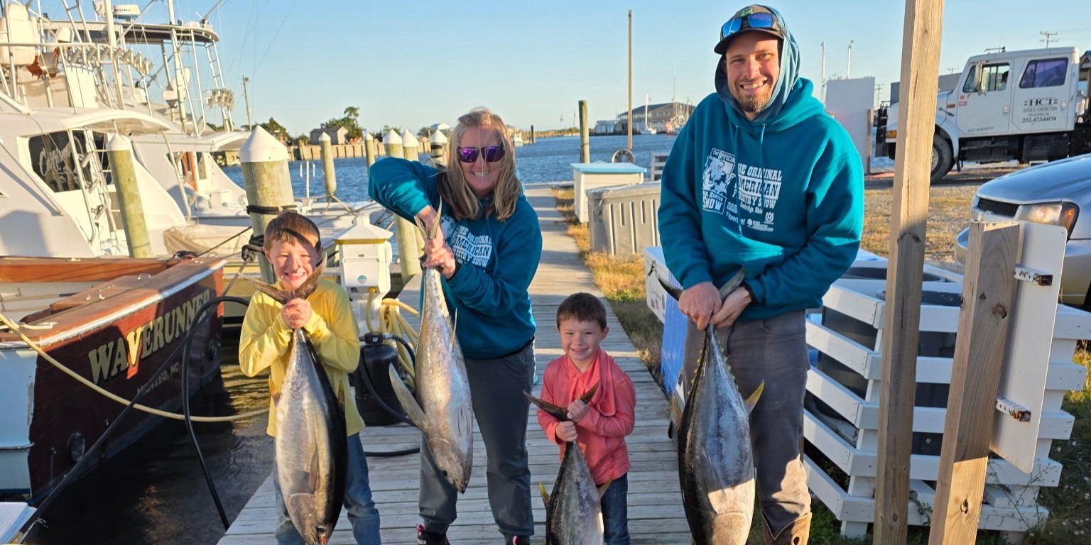 Outer Banks nearshore fishing charter boat with anglers catching bluefish and Spanish mackerel