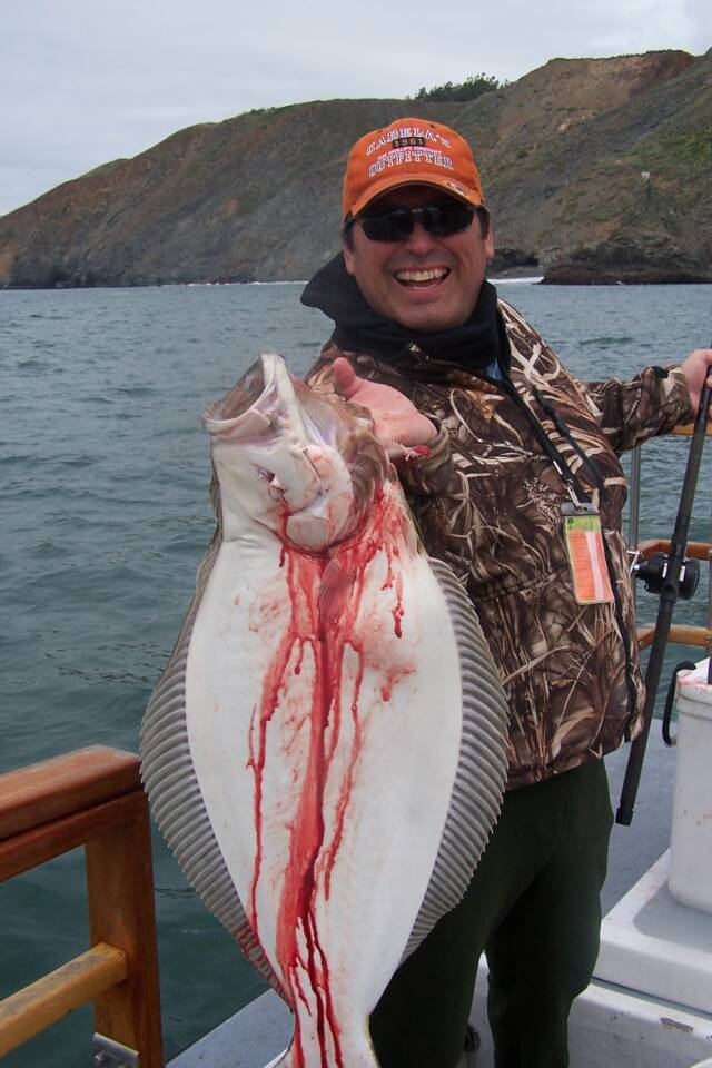 Angler holding a 23 inch fish in Richmond