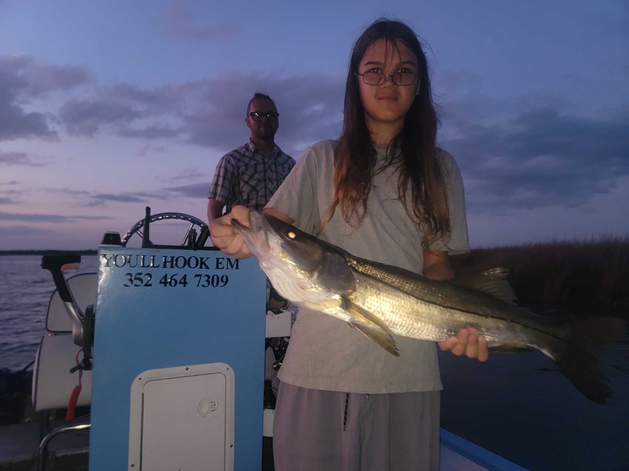 Snook caught during fishing charter in Homosassa FL at twilight on boat