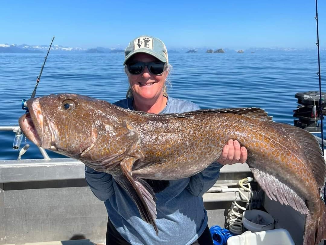 Angler holding a 35-inch fish in Alaska