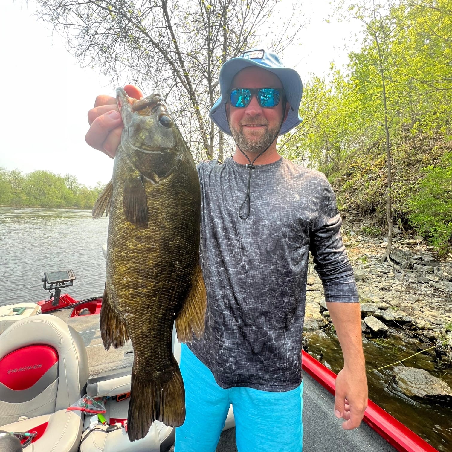 Angler holding a 26-inch fish in Royalton