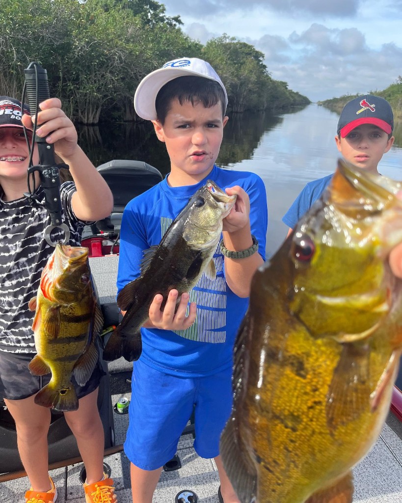 Three people enjoying a fishing trip in Parkland