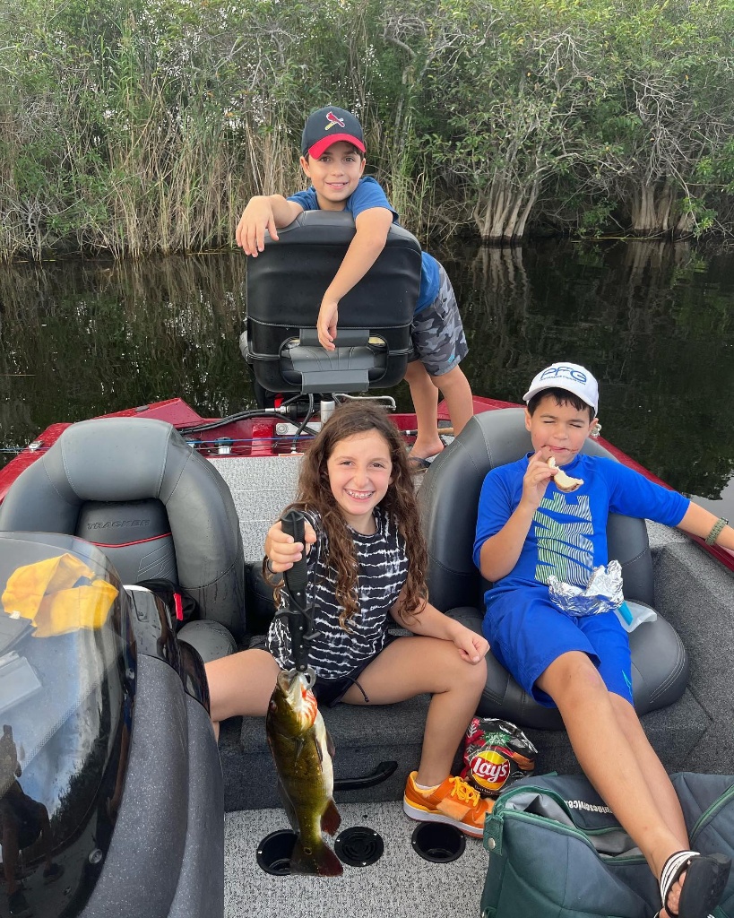 A group of 3 people fishing on the coast of FL