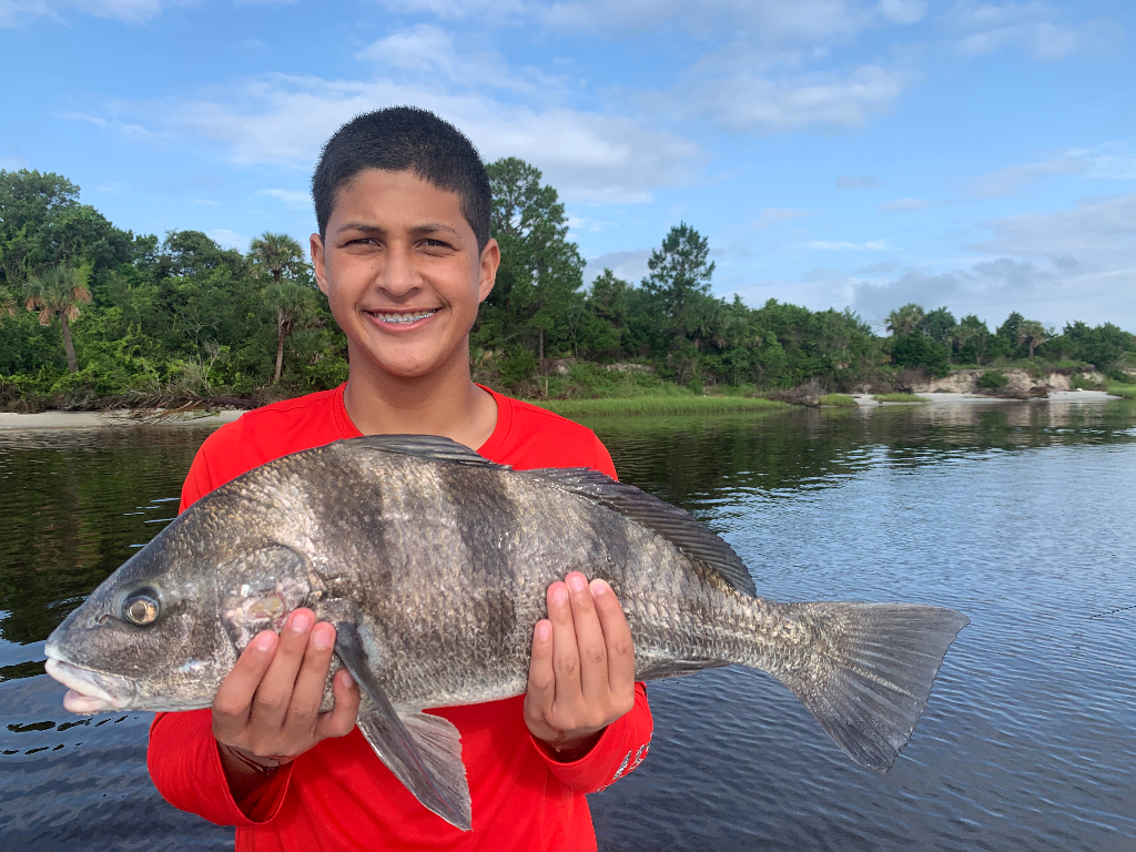 Photograph of a large black drum fish caught at Neptune Beach