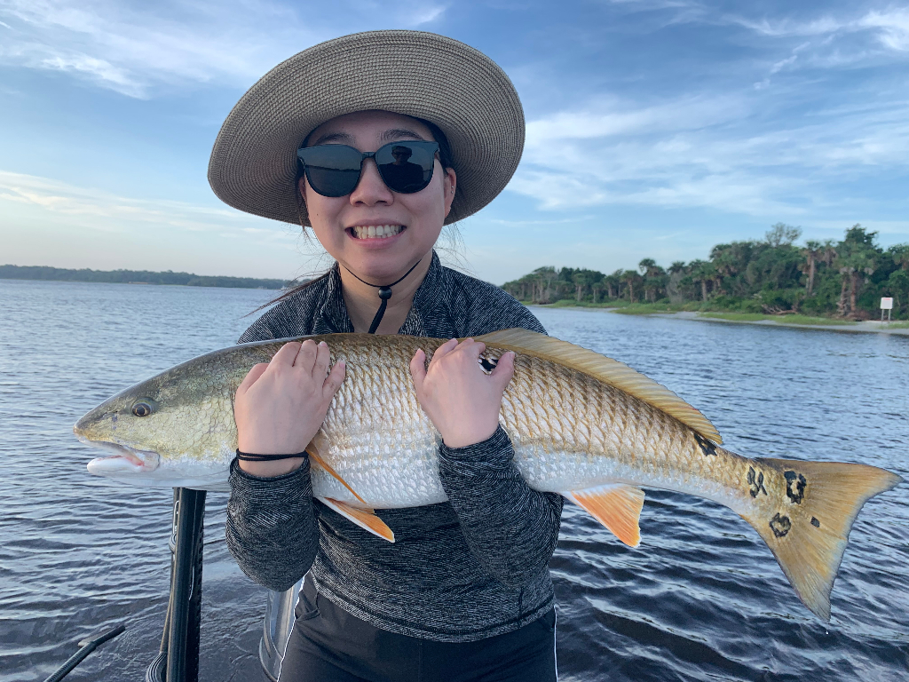 Angler with a fish at Neptune Beach