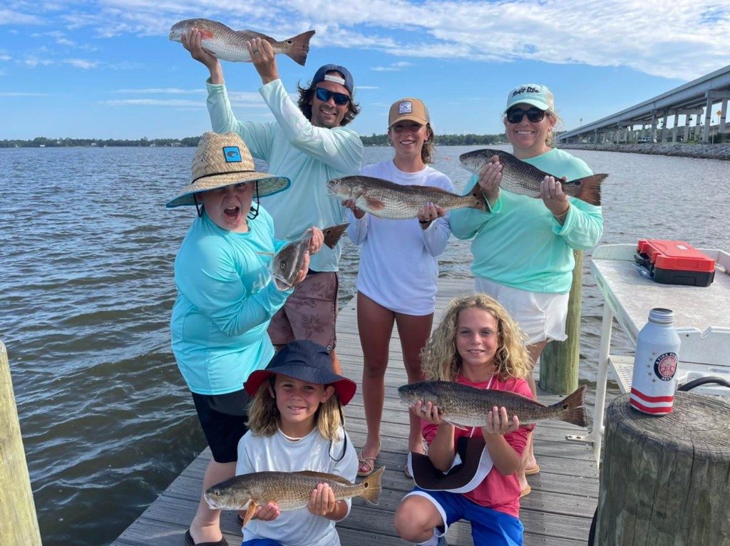 4 fishing rods with 4 caught fish in FL