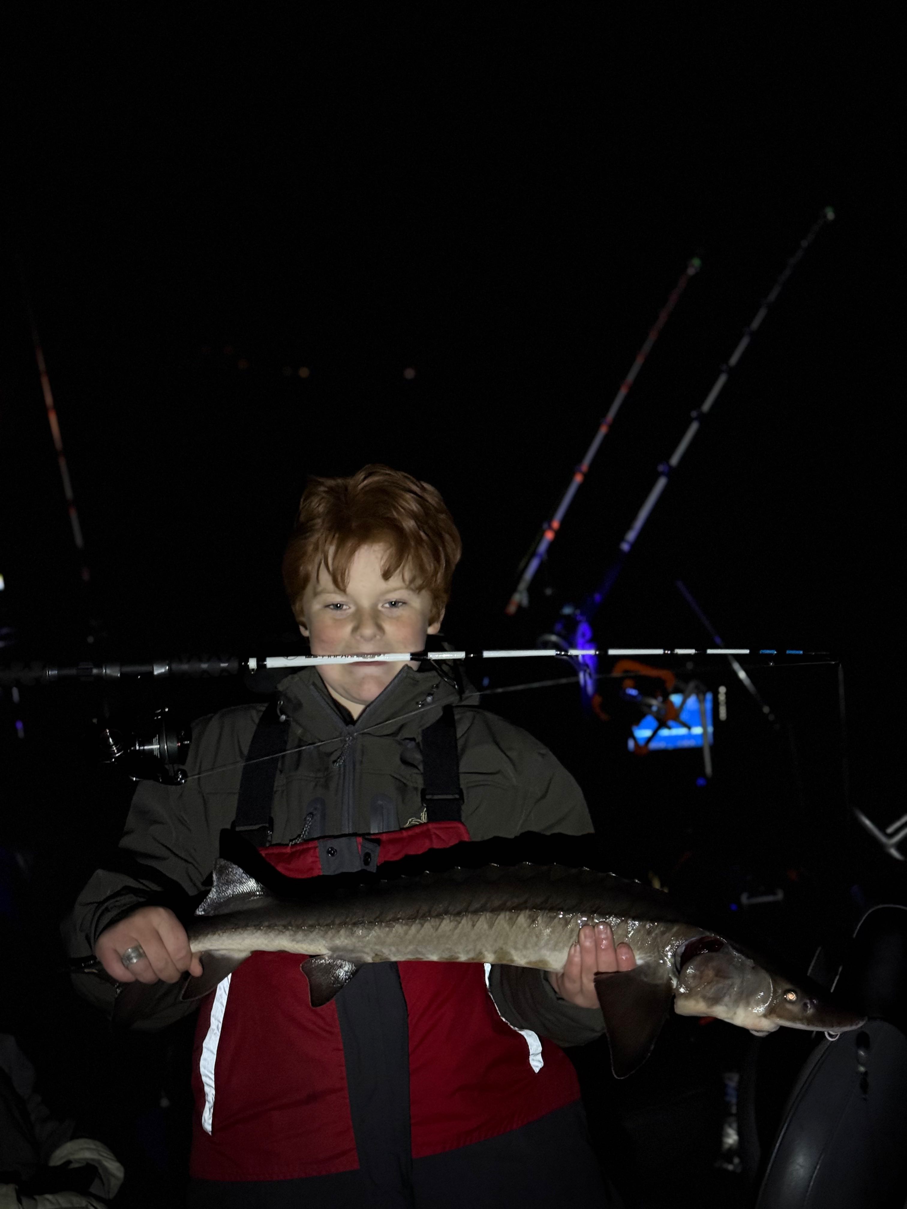 Lake sturgeon catch displayed on fishing boat in Stillwater MN