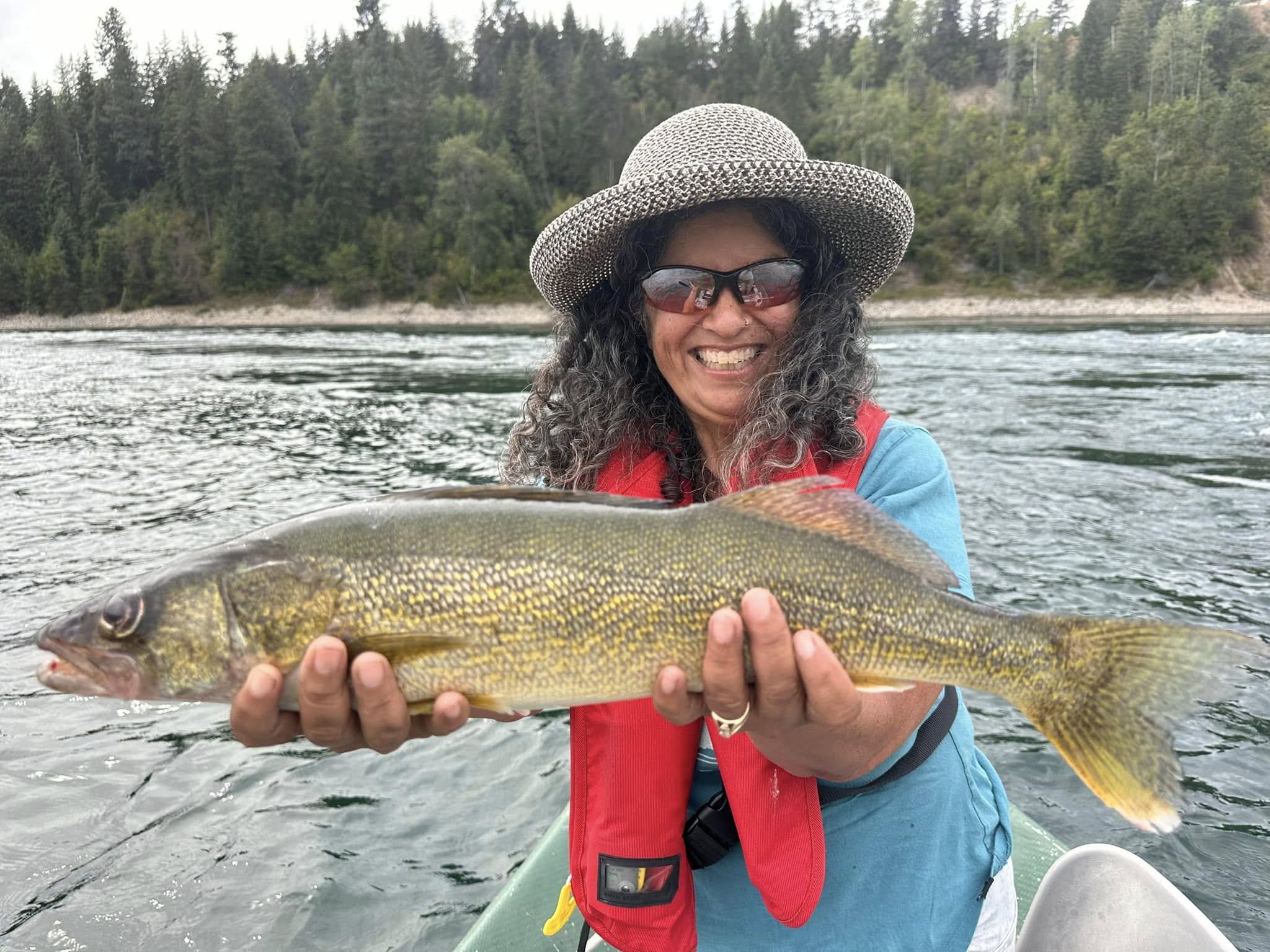 A person fishing in the beautiful landscape of British Columbia