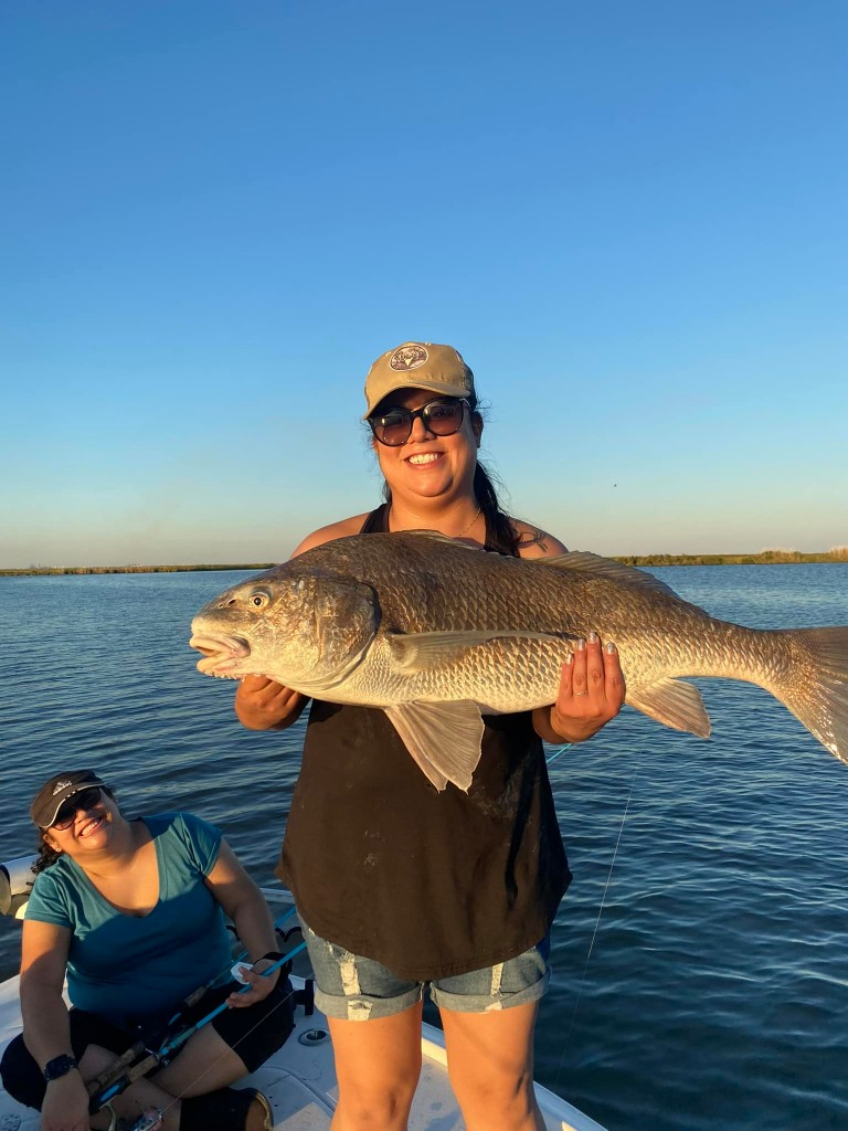 A lone fisherman reeling in a big catch in TX