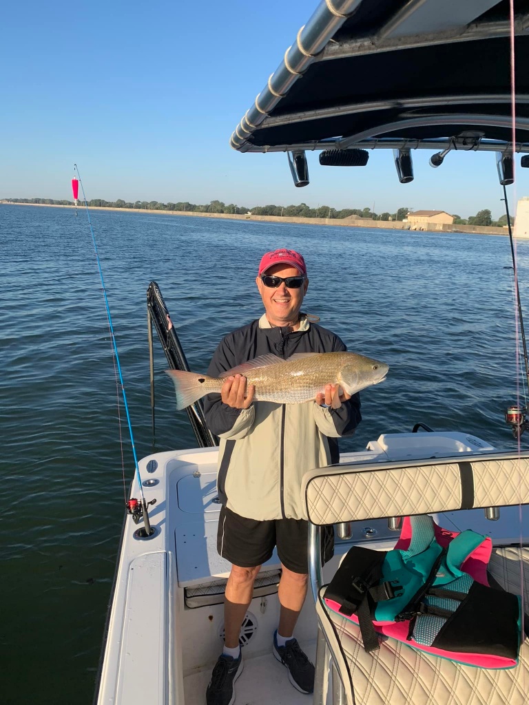 Lone angler reeling in catch in TX