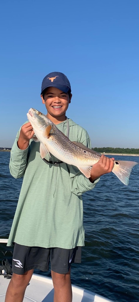 A lone fisherman in TX with a 12-inch catch