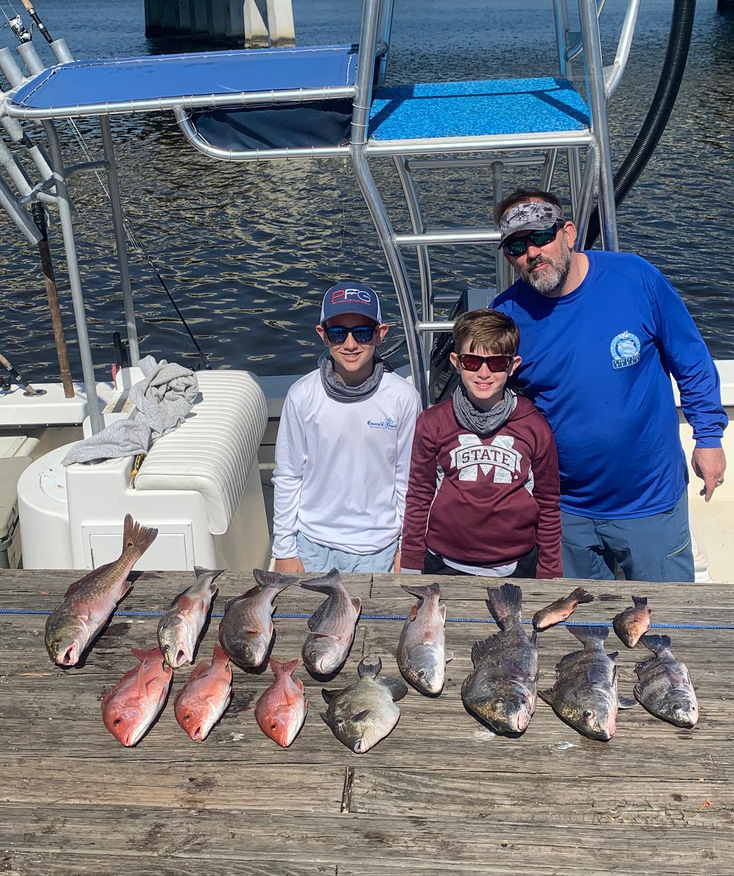 Photograph of 7 black drum and sauger fish caught in FL