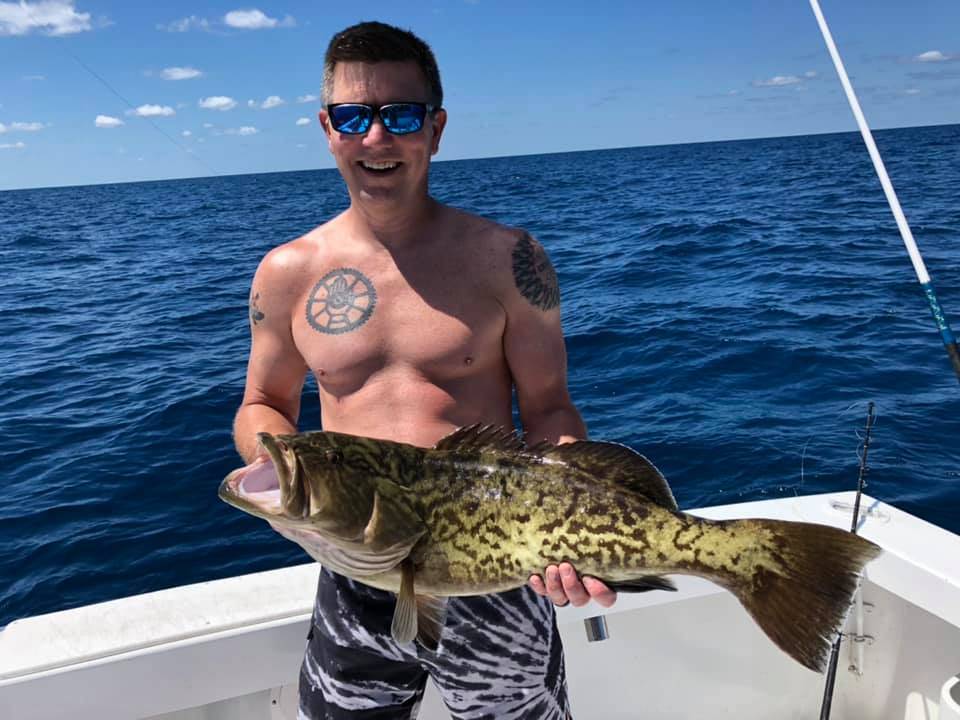 A person fishing in the waters of Fort Pierce