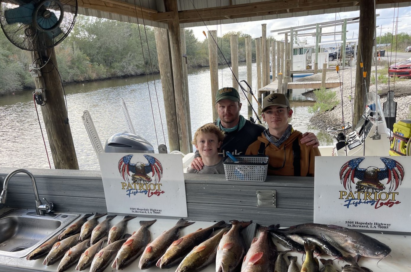 2 fishing rods with 3 people in St Bernard