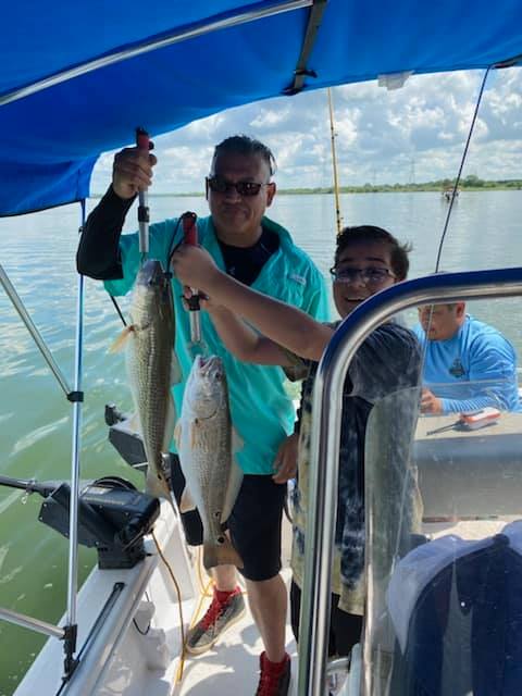 Two anglers fishing in TX with big fish