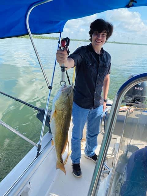 A lone angler with a big fish in TX