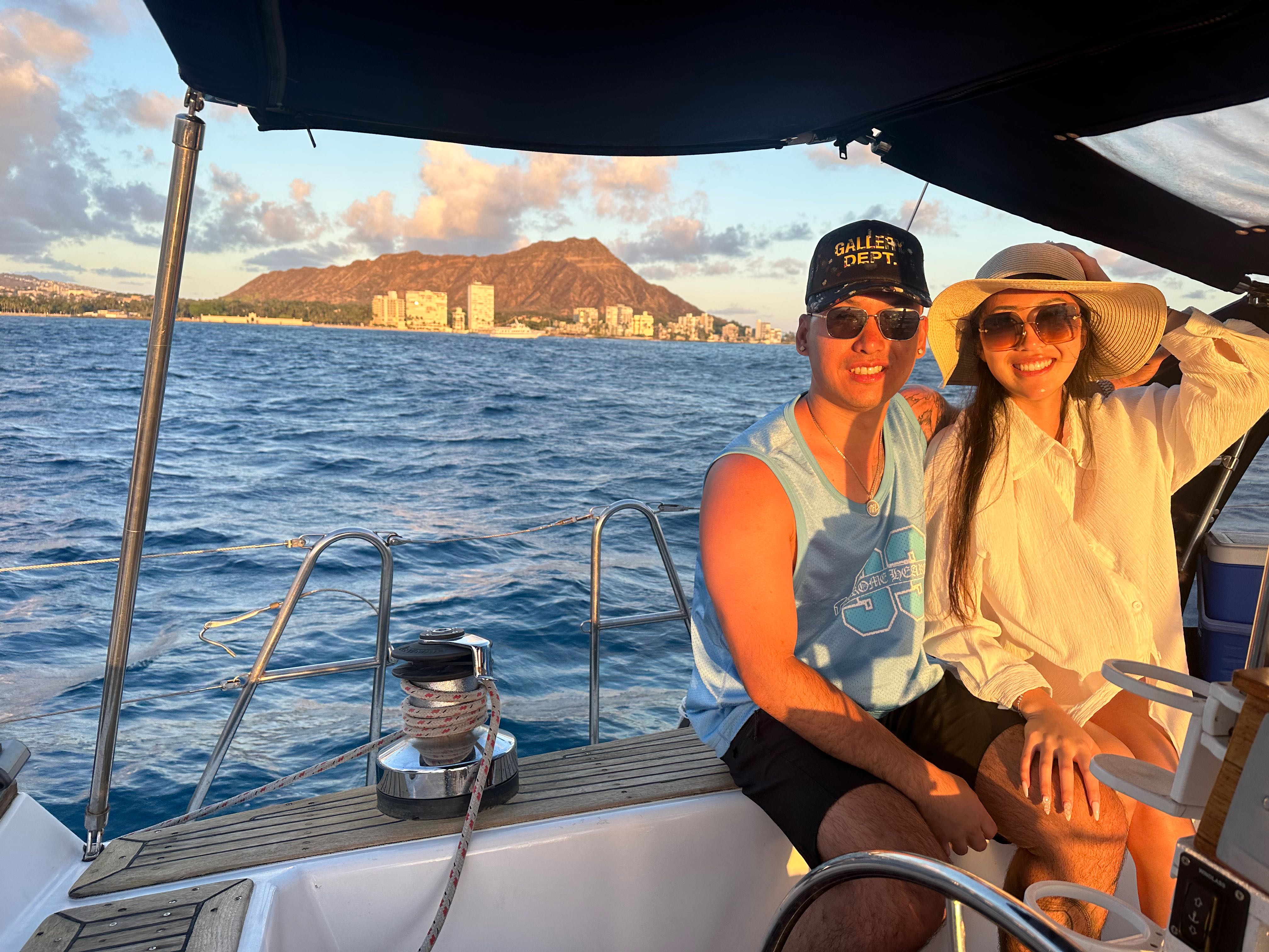 Cruise boat on ocean waters near Honolulu Hawaii with Diamond Head mountain in background