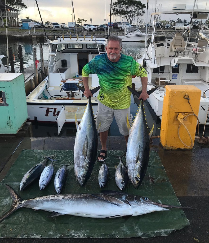 Three large yellowfin tuna, blackfin tuna, and blue marlin caught in Haleiwa