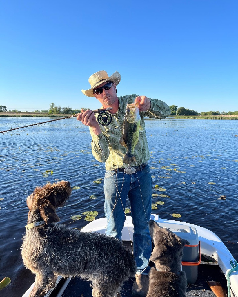 Angler holding a 12-inch fish in WI