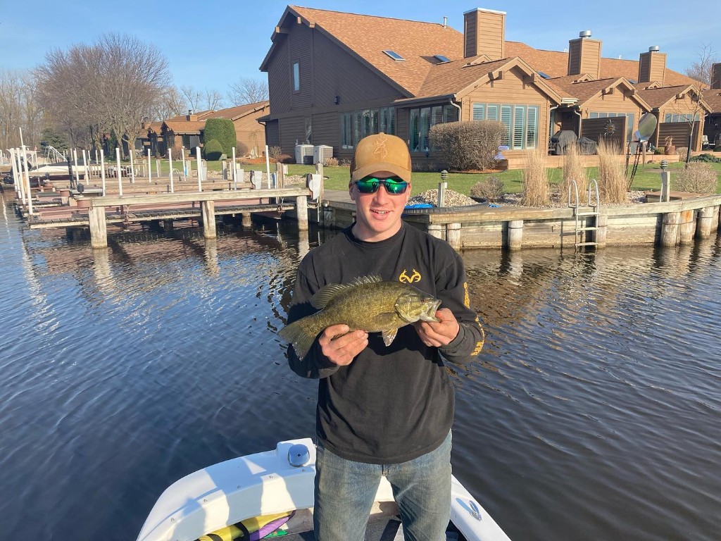 Angler fishing in Omro, with a 13-inch catch