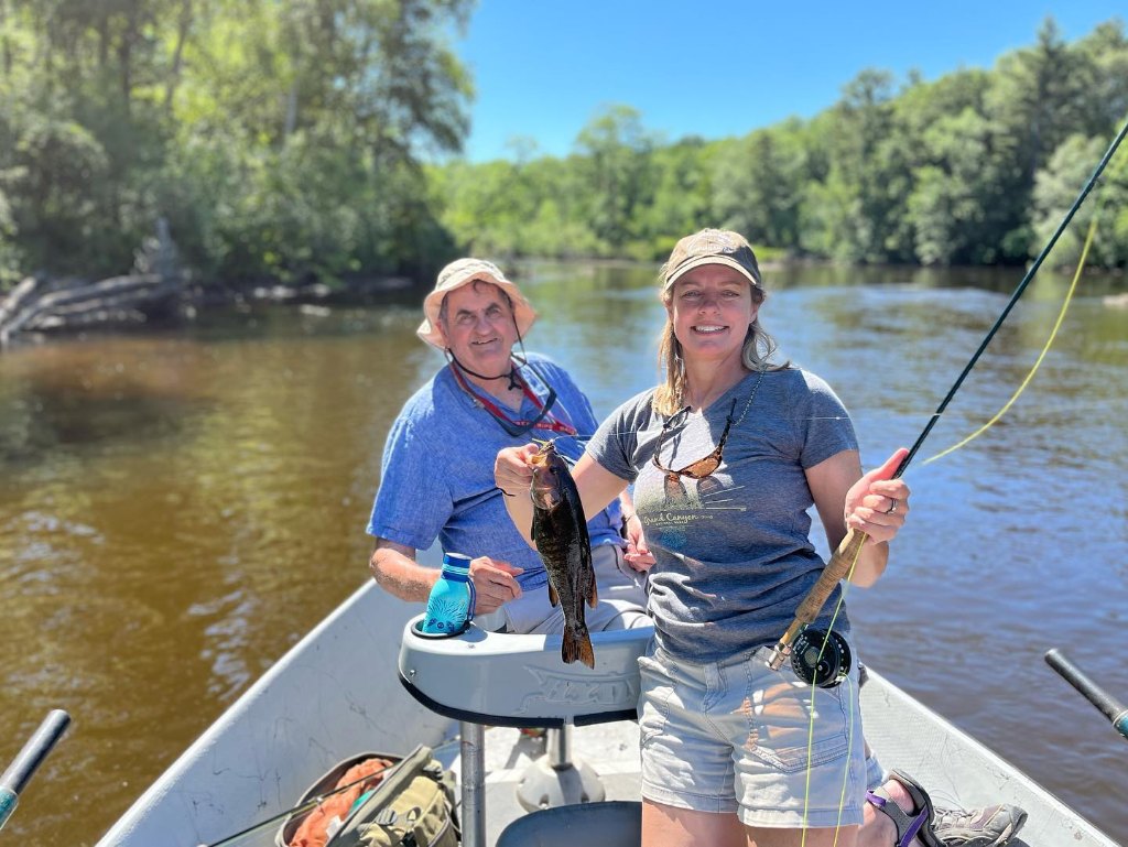 Two people enjoying a day of fishing in WI
