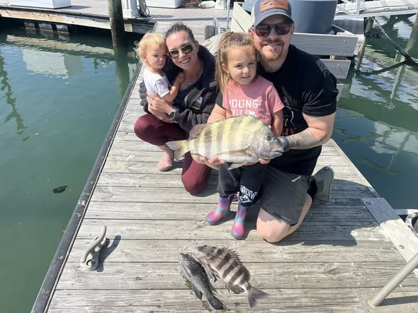 Family fishing trip in Murrells Inlet SC with caught sheepshead on dock