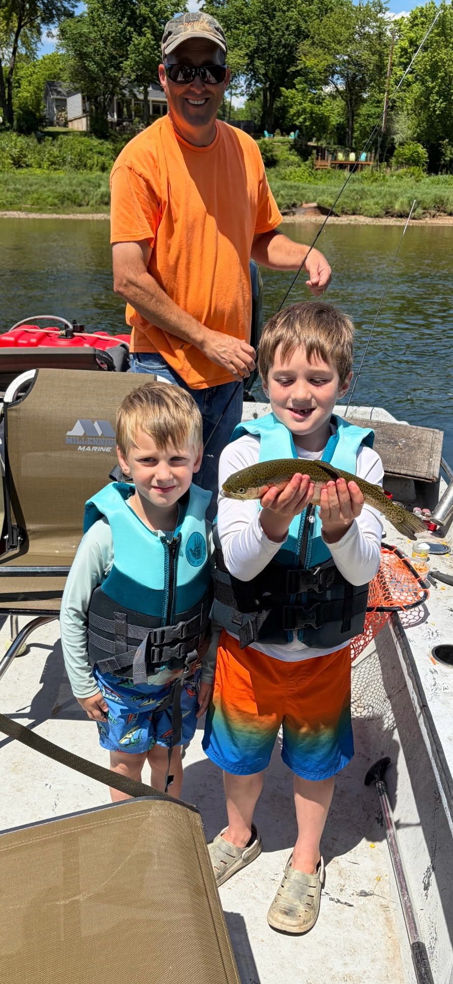 Fishing trip in Cotter AR with caught fish displayed on boat