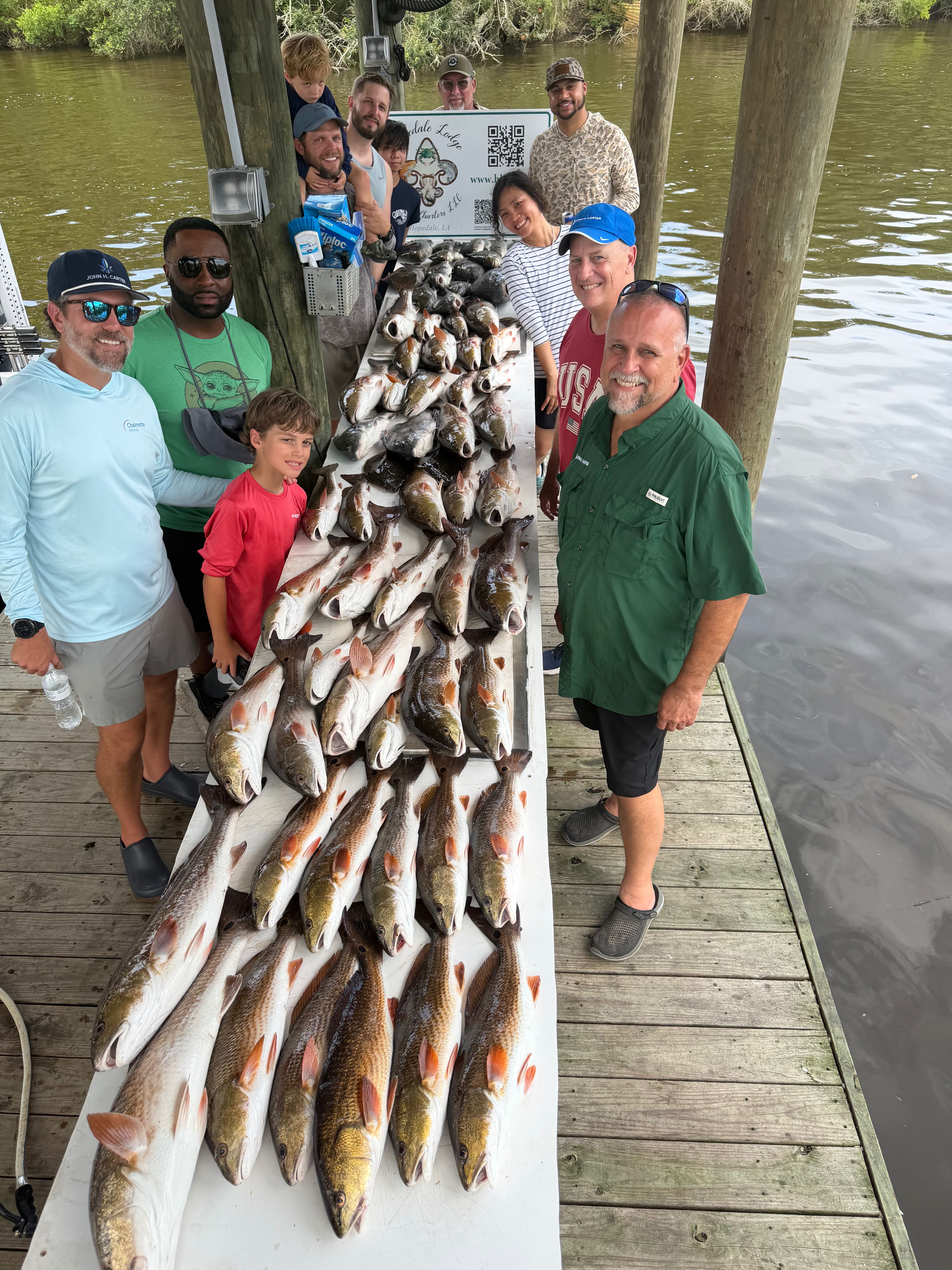 Large catch of redfish displayed on fishing dock in St Bernard Louisiana