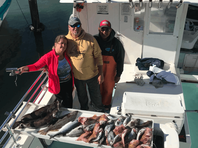 Four people enjoying fishing trip in San Francisco