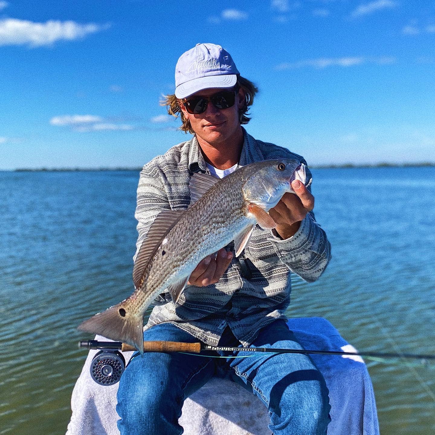Angler holding a redfish in Florida