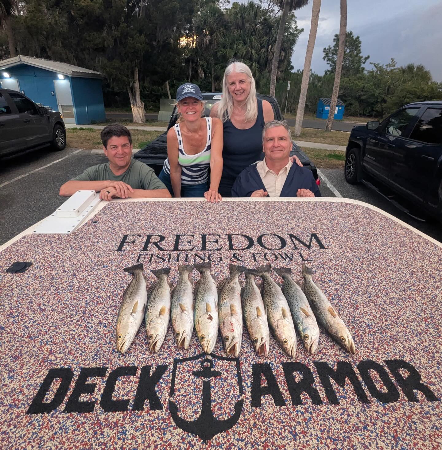 Fishing charter catch of speckled trout displayed on boat deck in Spring Hill FL