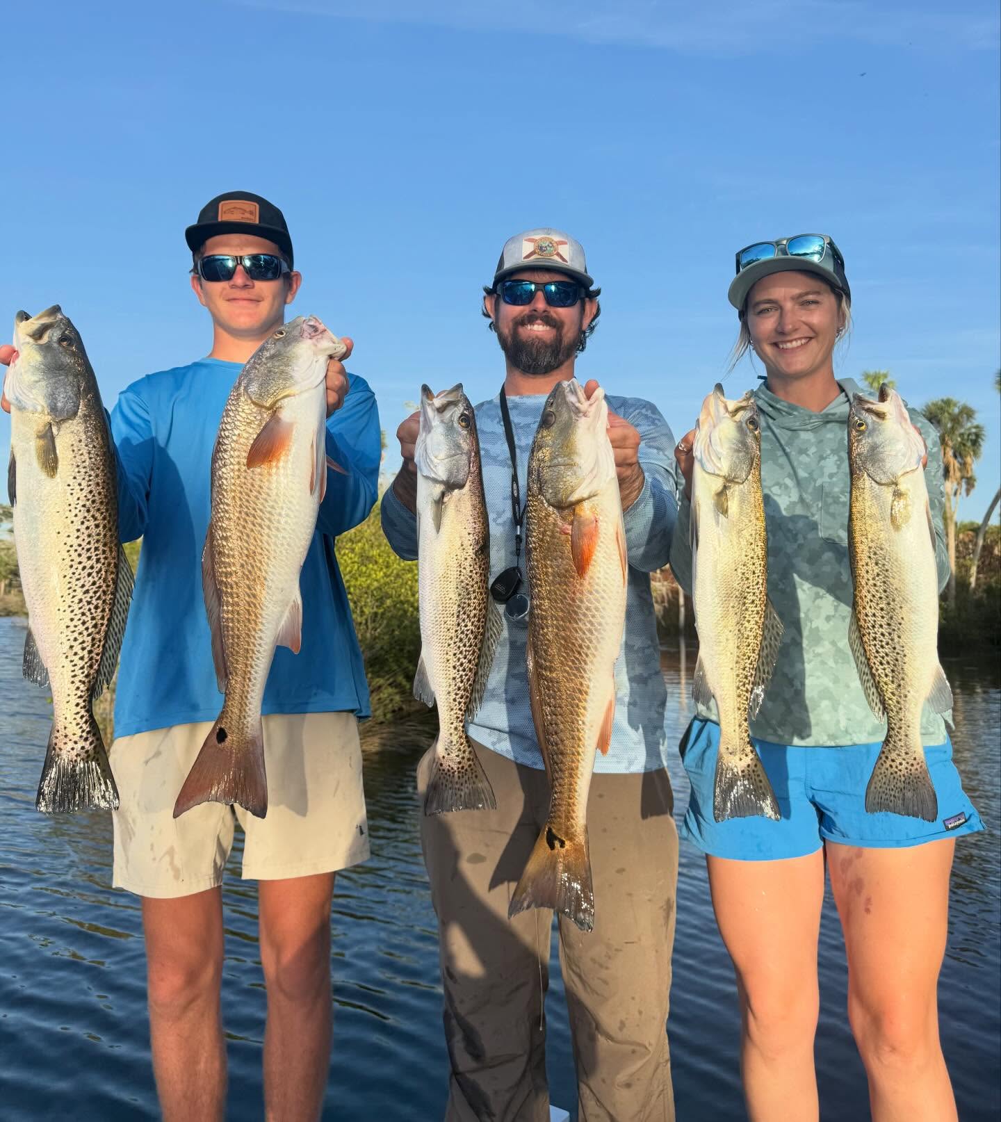 Successful fishing trip in Spring Hill FL with six caught fish including speckled trout and redfish
