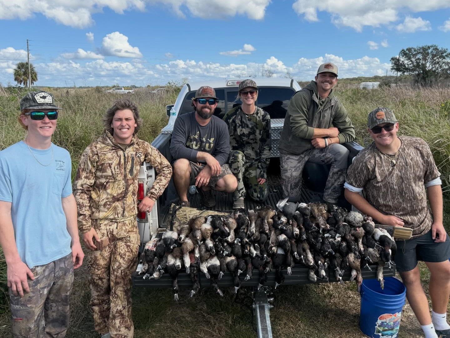 Duck hunters in coastal marsh with decoys targeting redhead and bluebill ducks in Bayport FL