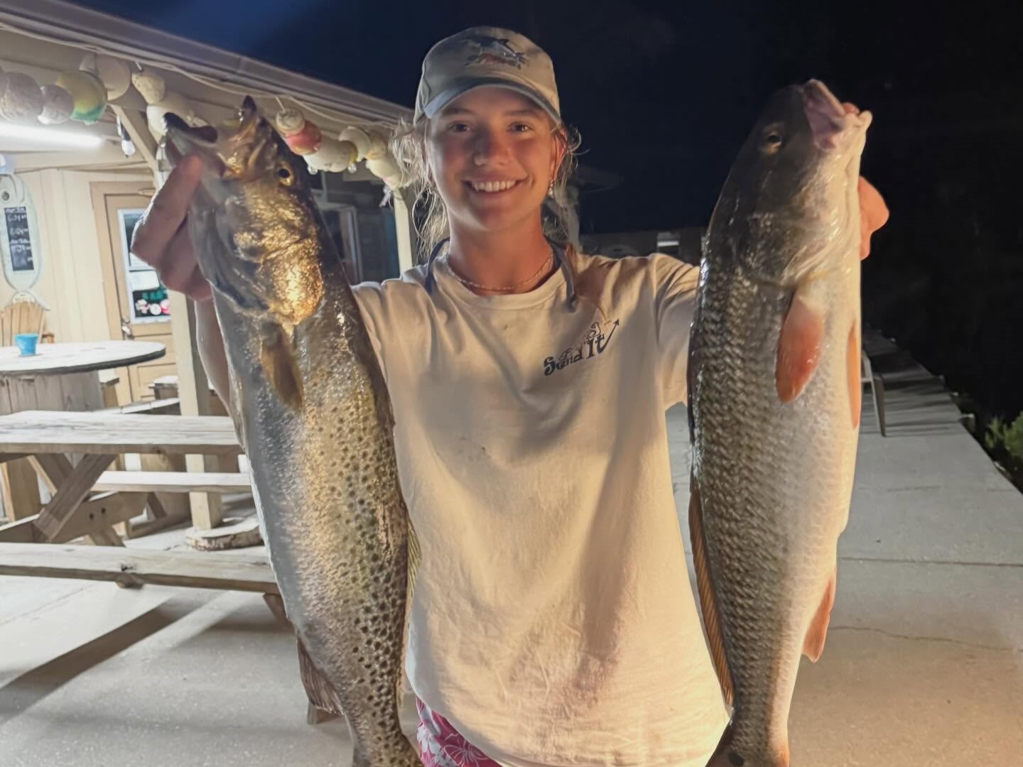 Night inshore fishing charter boat in Spring Hill FL targeting redfish, snook, and trout