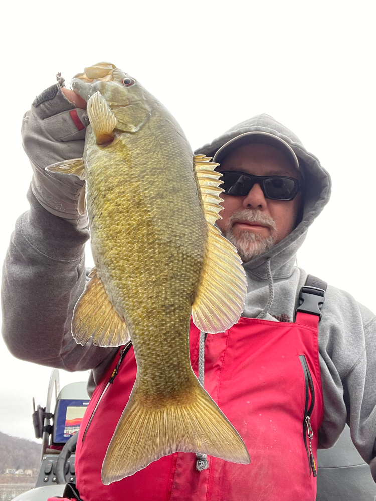 A lone angler in Dunmore, fishing a 22-inch catch