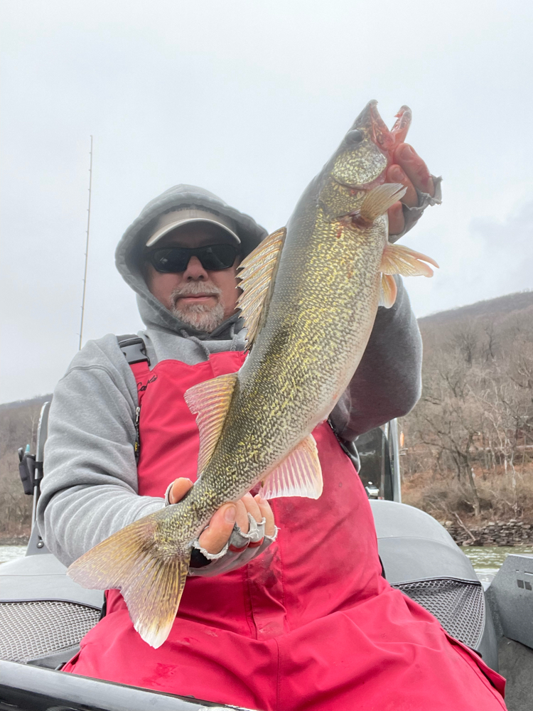 A lone fisherman standing in a river in PA