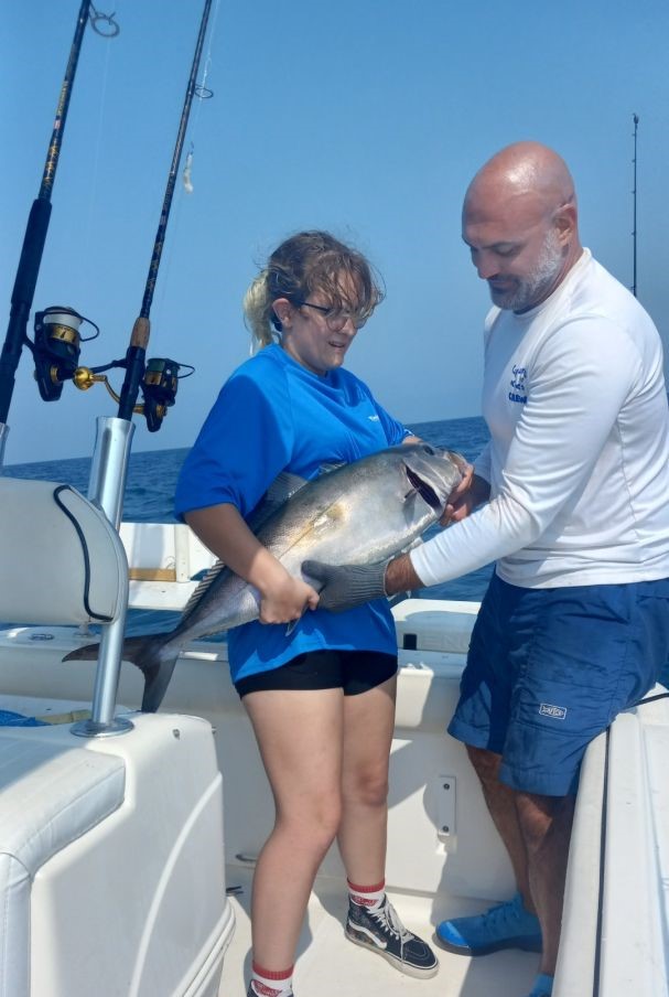 Two anglers enjoying a fishing trip in Gulf Breeze
