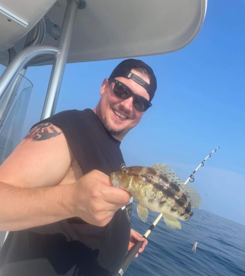 A person fishing with a rod in the Gulf Breeze, Florida