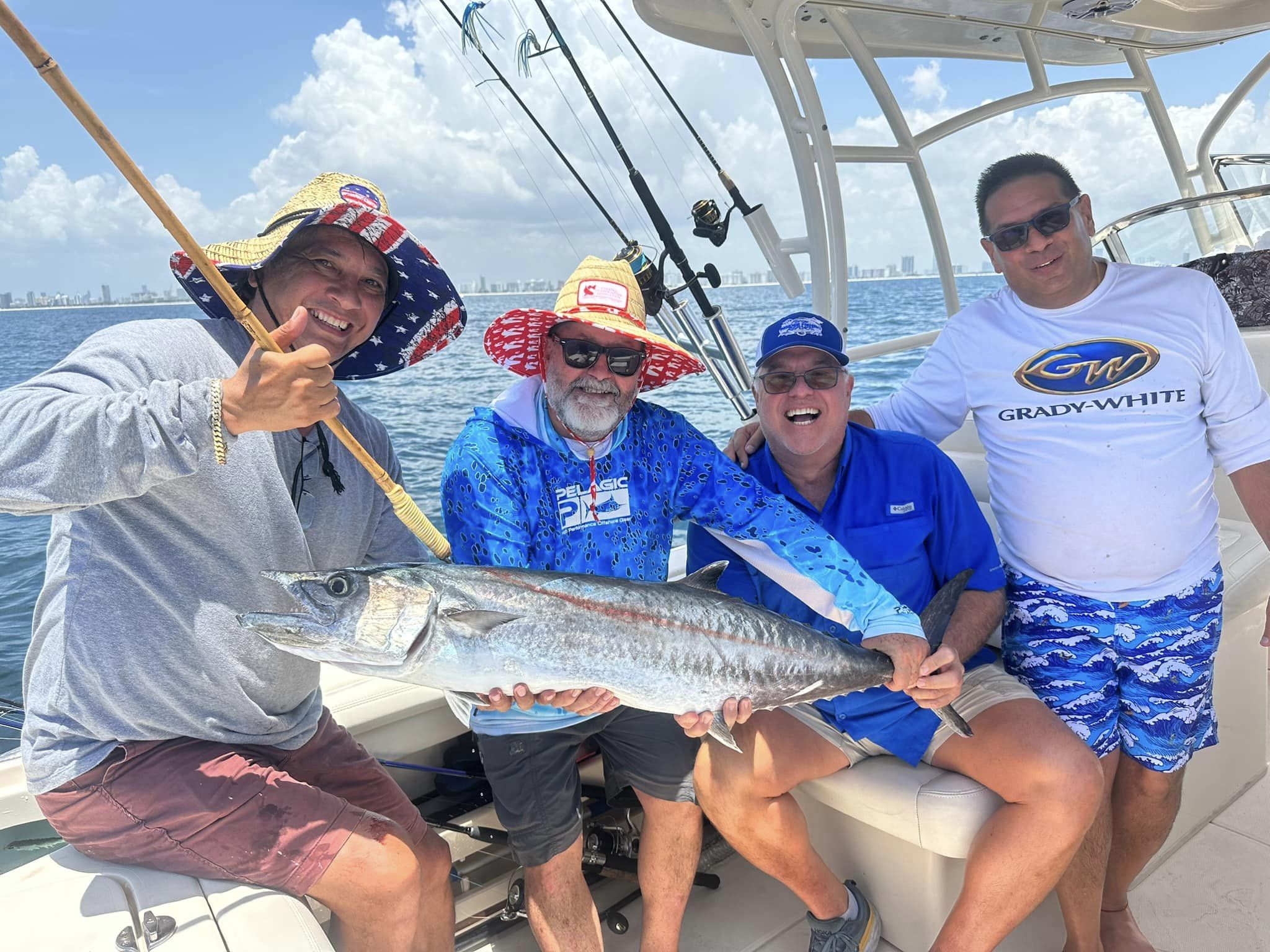 Angler holding a king mackerel fishing in FL