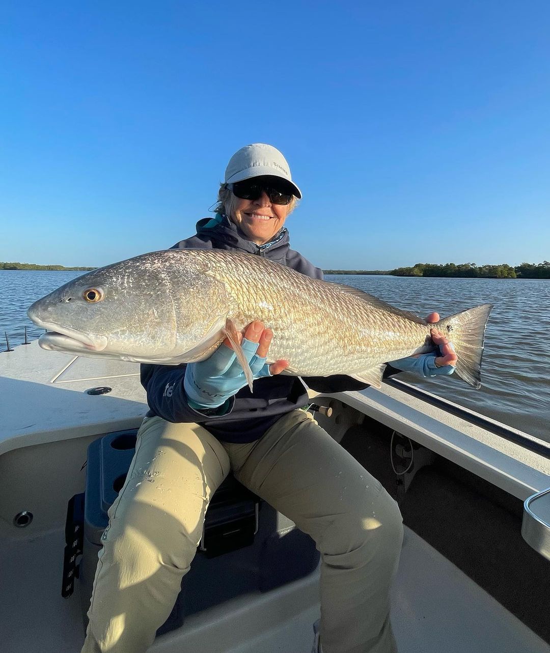 Angler with a large fish caught in Naples