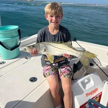Snook catch displayed on fishing boat in Edgewater FL waters