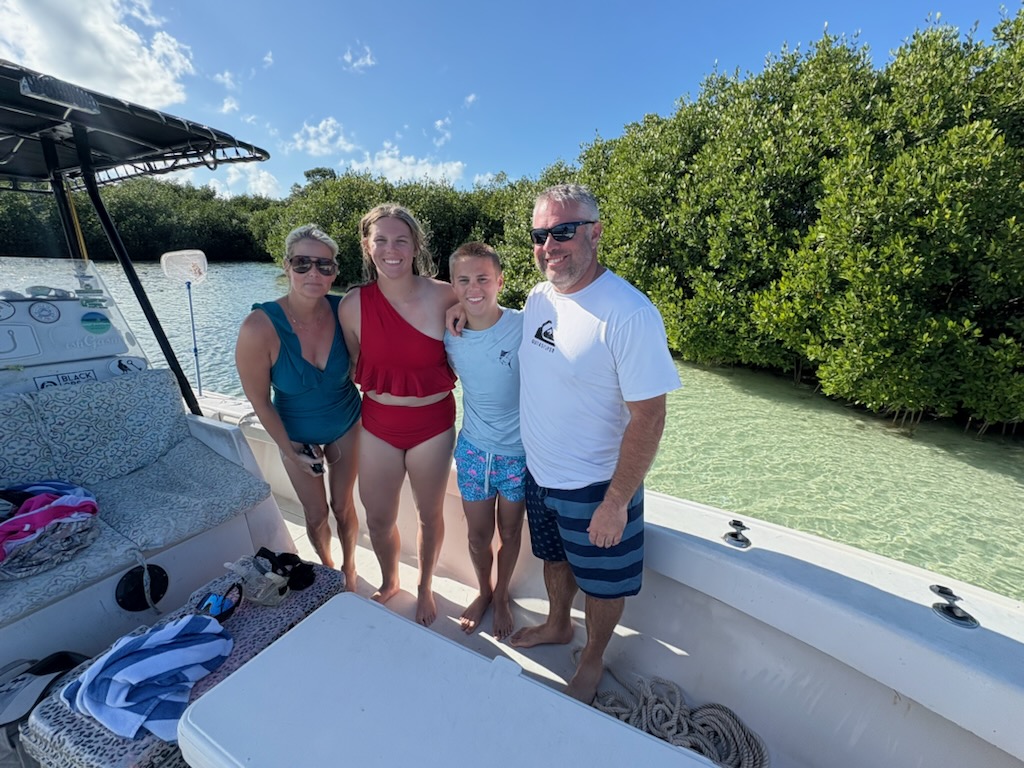 Four people enjoying an exciting fishing tour in FL