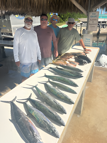 Three people on a boat in Big Pine Key, Florida enjoying fishing, tours, and water sports