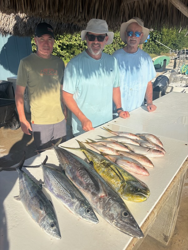 Three people fishing on the water in Florida