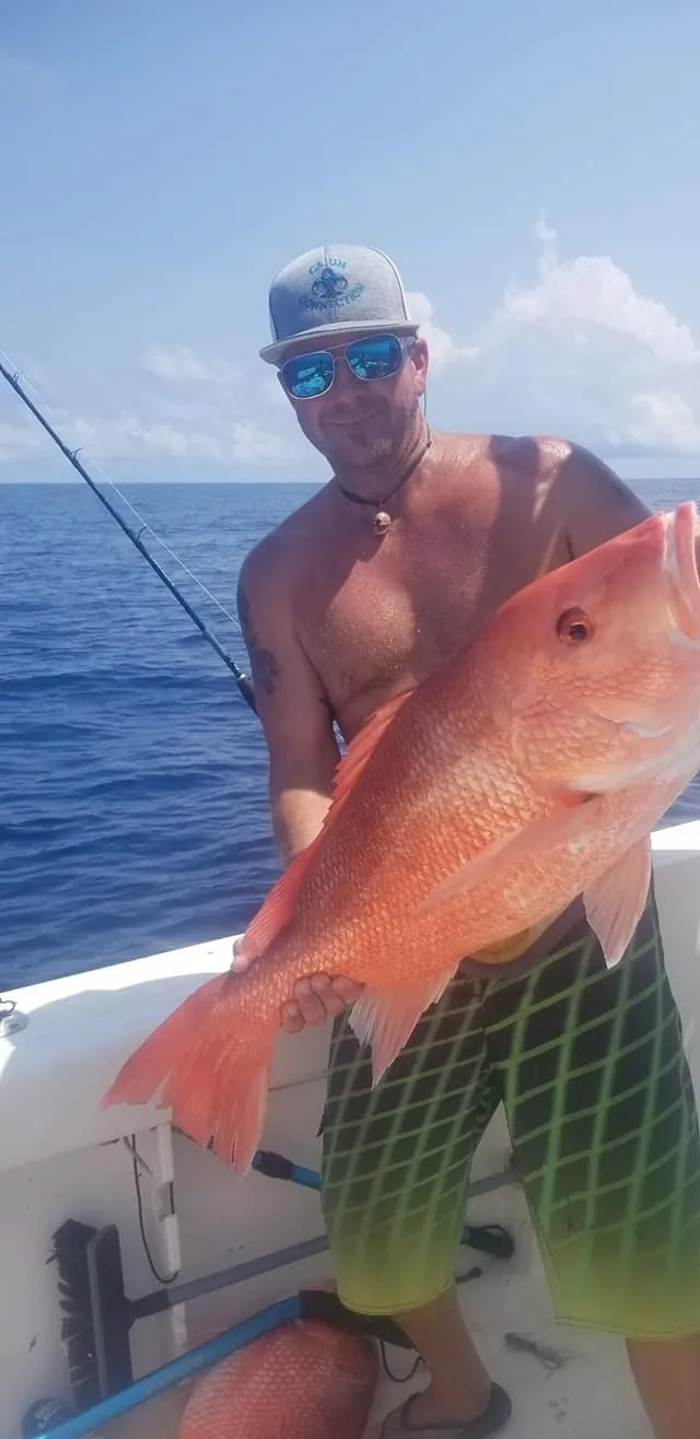 One person fishing in a body of water in Texas