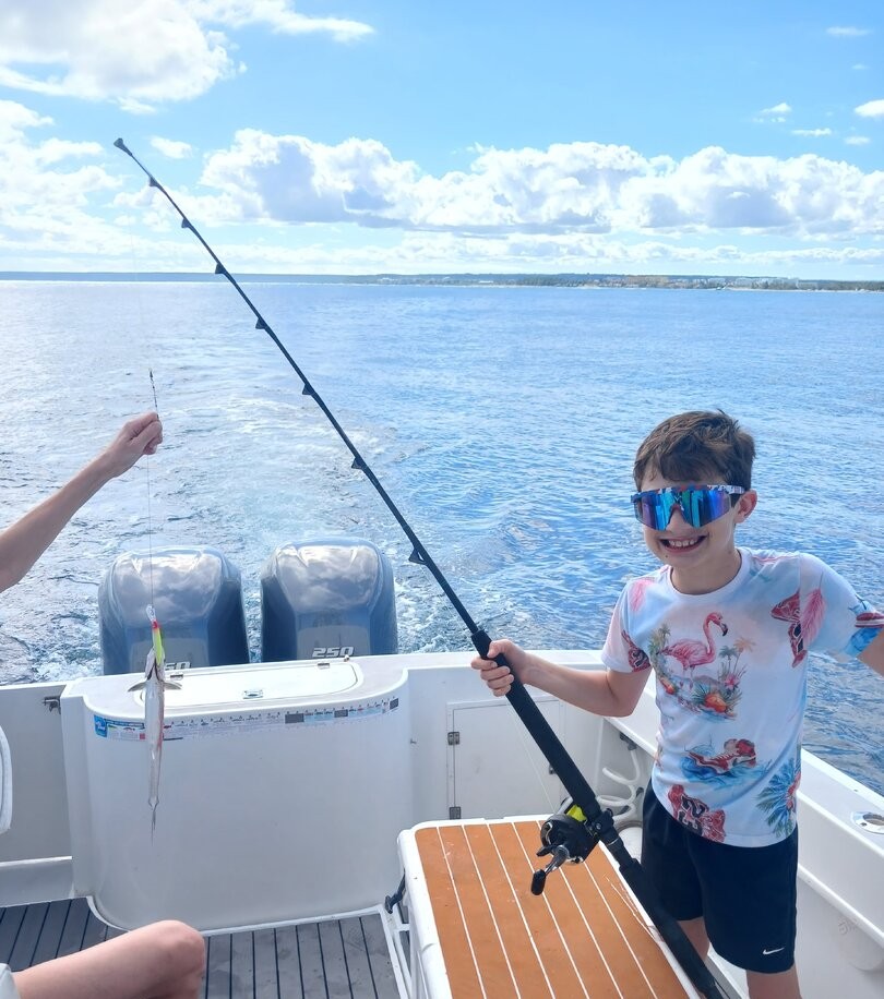 Deep sea fishing with rod bent from catch in Punta Cana waters