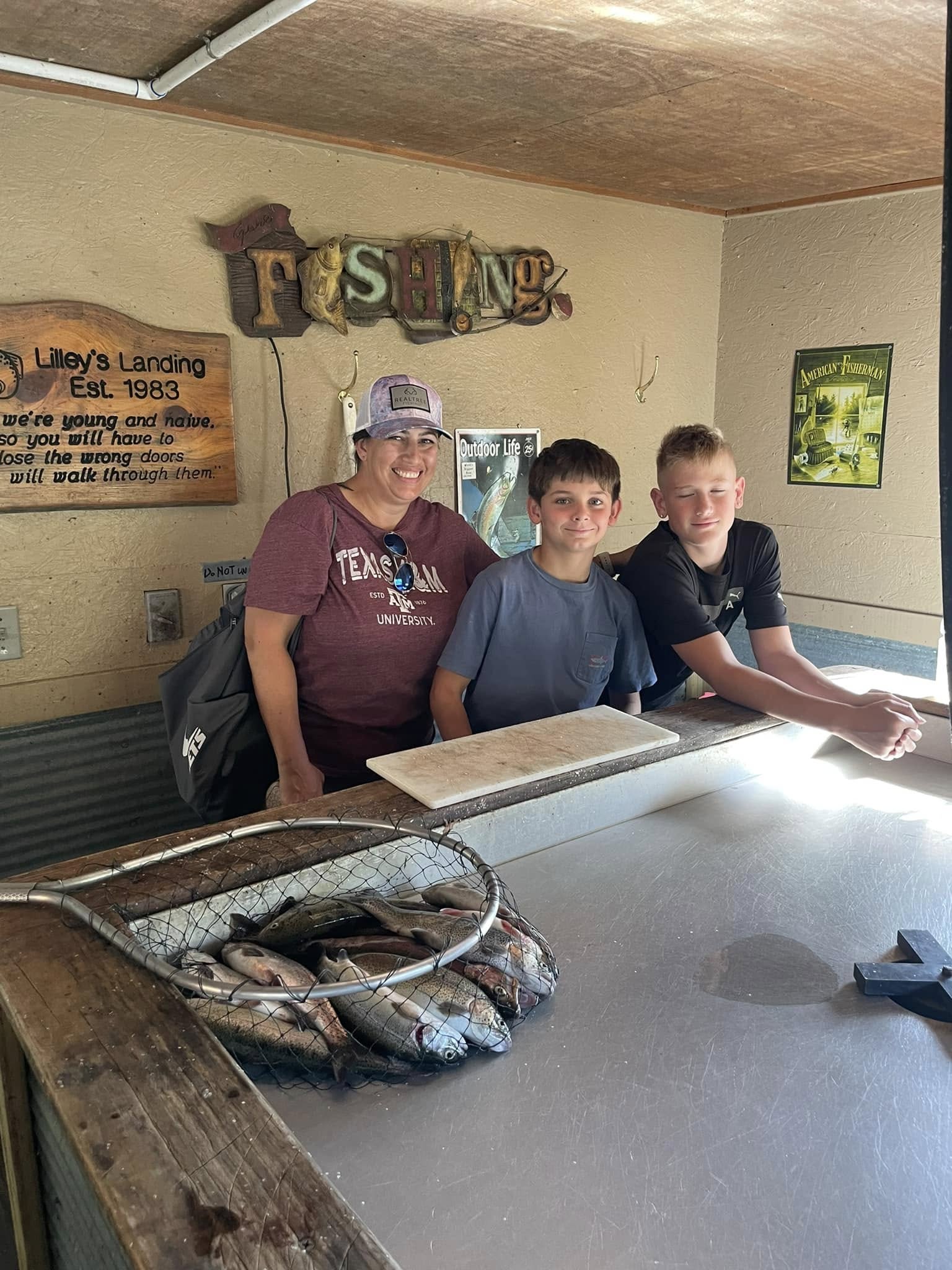 Three people fishing on the river in MO