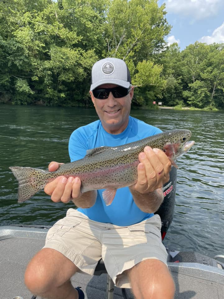 Photograph of a 21-inch rainbow trout caught while fishing in MO