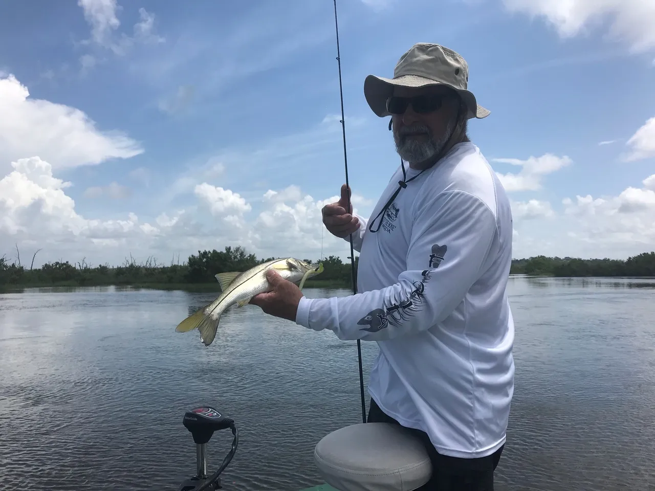 Angler holding a small fish in FL