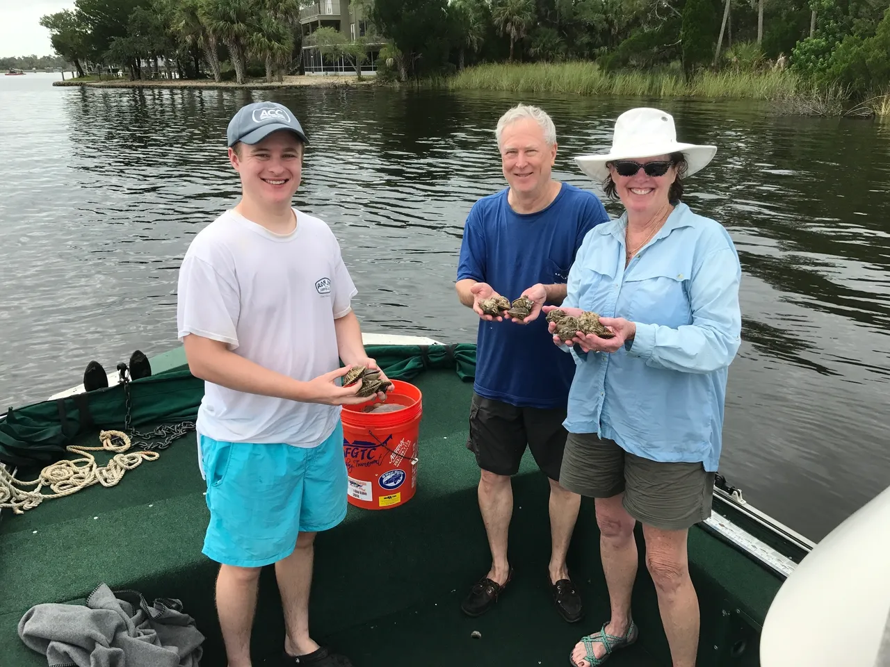 Three people fishing on the shore of Crystal River